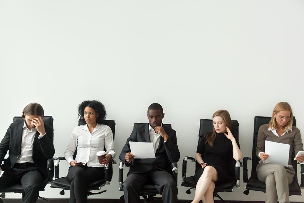 Office Space, employees sitting down 