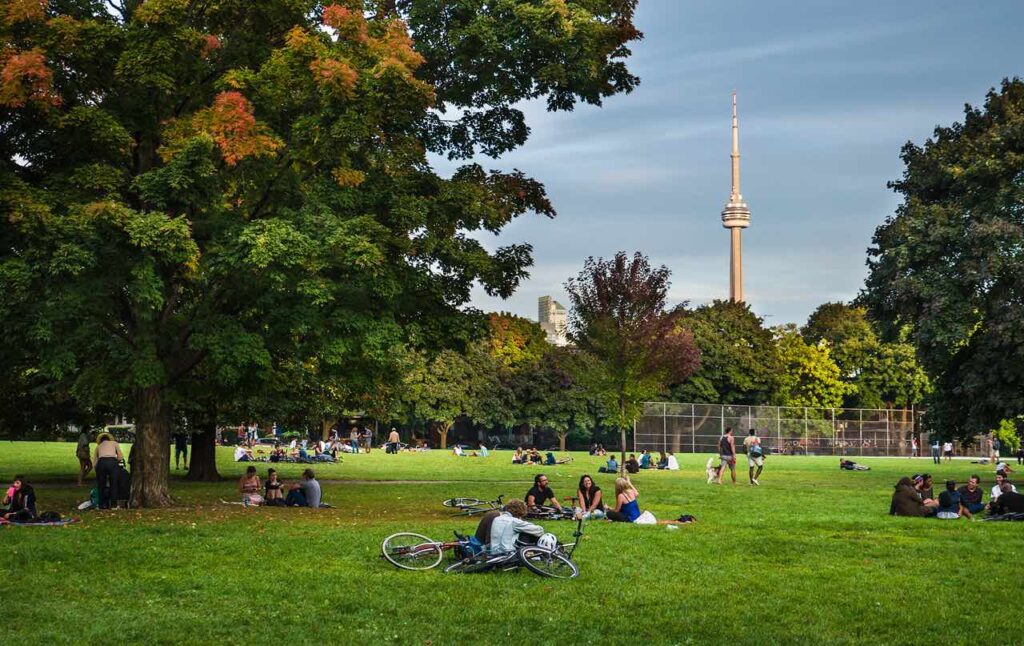 Friends gathering in Trinity Bellwoods park in Toronto, Ontario.